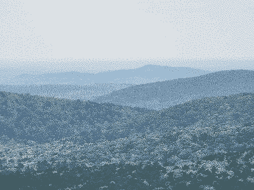 photo of rolling hills and trees, taken from the top of one of the peaks of ouachita